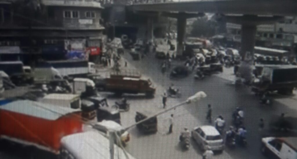 Traffic and dust plague the city's population